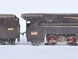a toy train that is sitting on a white surface