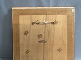 a wooden box with a clock on it on a blue background