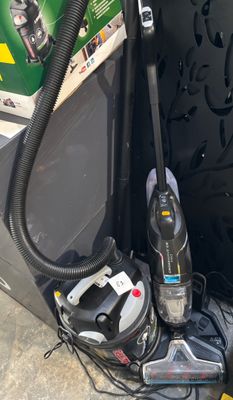 a picture of a vacuum and other household items on the ground