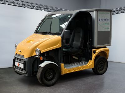 a small yellow vehicle parked in a garage
