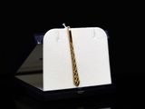 an image of a gold tie on a black background