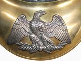 a gold collar with an eagle on it