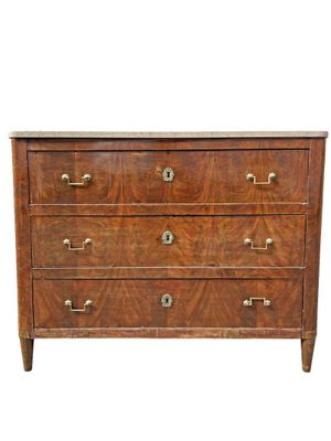 a wooden chest of drawers with brass handles and drawers