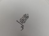 an image of a close up of a white plate with a castle on it