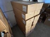 a pile of boxes stacked on top of each other in a room
