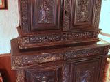 a large wooden cabinet in the corner of a room