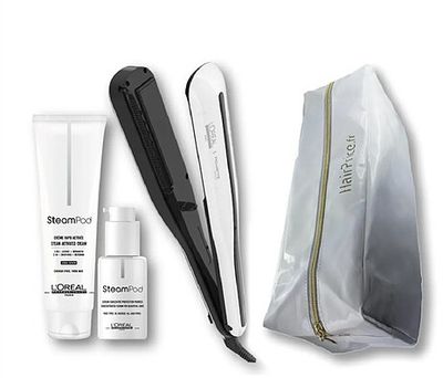 the contents of a hair care kit include a hair straighten, a bag, and a hair brush