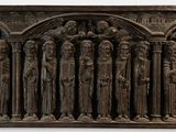 an image of a bronze plaque of a group of people