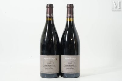 two bottles of red wine sitting next to each other on a white surface