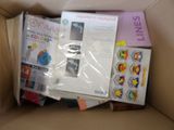 a cardboard box filled with books and other items