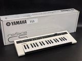 an image of a white electronic keyboard sitting on top of a table
