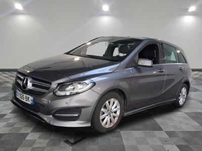 the mercedes b - class is parked on a checkered floor
