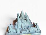 a small model of a mountain with trees on it