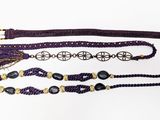 three different types of bracelets with black beads on a white background