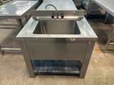 an image of a stainless steel sink in a kitchen area