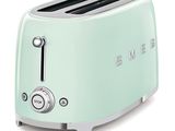 un grille-pain vert menthe sur fond blanc, portant l'inscription « Smeg »