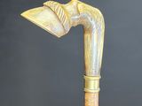 an image of a wooden walking stick with a wooden handle