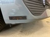 a close up of a car with a sticker on it ' s bumper