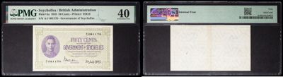 three different types of currency are on display in a display case