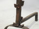 an old iron table with a wooden top on a white surface