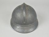 a helmet that is sitting on a white surface