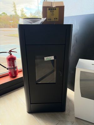 a microwave sitting next to a box on the floor