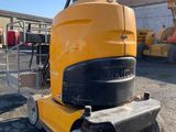 an image of a construction vehicle parked in a parking lot