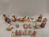 many figurines of different types and sizes on the table