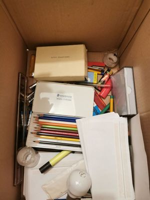 a box full of school supplies that are in the box