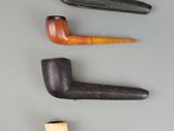 three different types of pipe sitting on top of a table
