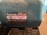 a close up of a blue machine with a sticker on it