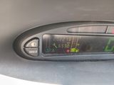 a digital clock on the dashboard of a car