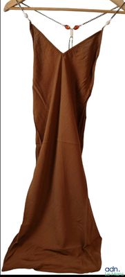 a brown dress hanging on a wooden hanger