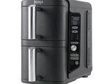 an image of a black and silver microwave oven on a white background