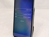 the back of a black samsung s9 phone with a display on it
