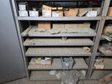 many shelves with boxes and boxes on them in a room