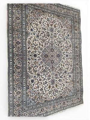 an antique persian rug with a floral design on a white background