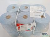 several rolls of blue toilet paper wrapped in plastic on a white surface