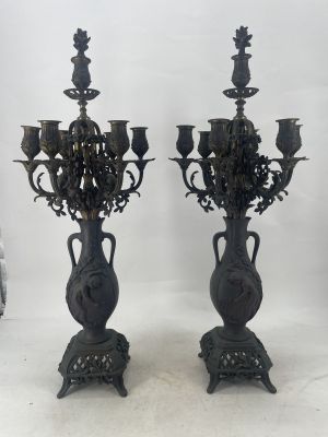 pair of antique cast iron candelabs with flowers and leaves