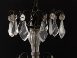 a chandelier that has a bunch of crystal hanging from it