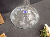a glass vase that is sitting on a table