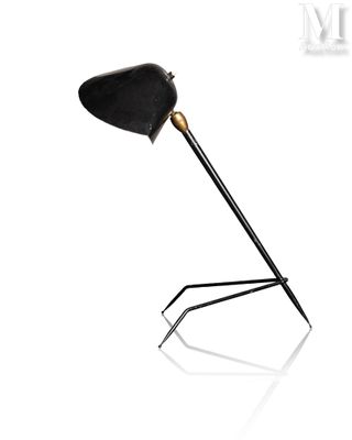 an image of a black and gold lamp on a white background