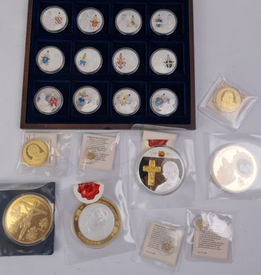 a lot of coins in a case on a table