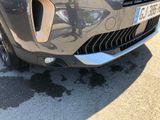 a close up of a car ' s front grill and bumper