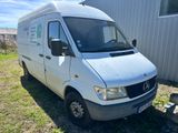 an image of a white van parked in the grass