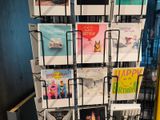 a display of greeting cards on a rack in a store