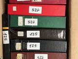boxes of books are stacked on top of each other in a box