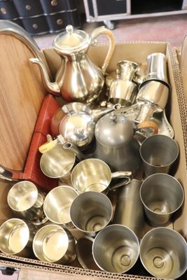 a box full of silver items sitting on the floor