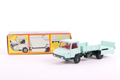 a toy truck that is sitting next to a box