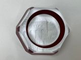 une plaque de verre sur laquelle est représenté un bâtiment